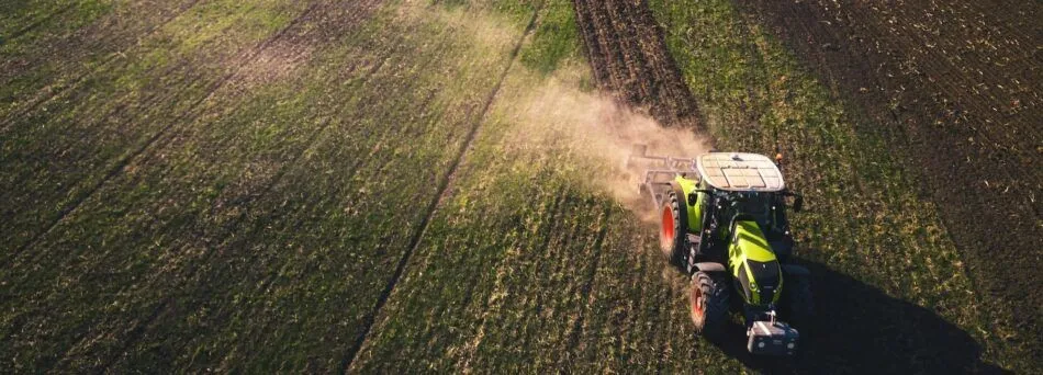 tractor ploughing a field on a farm.