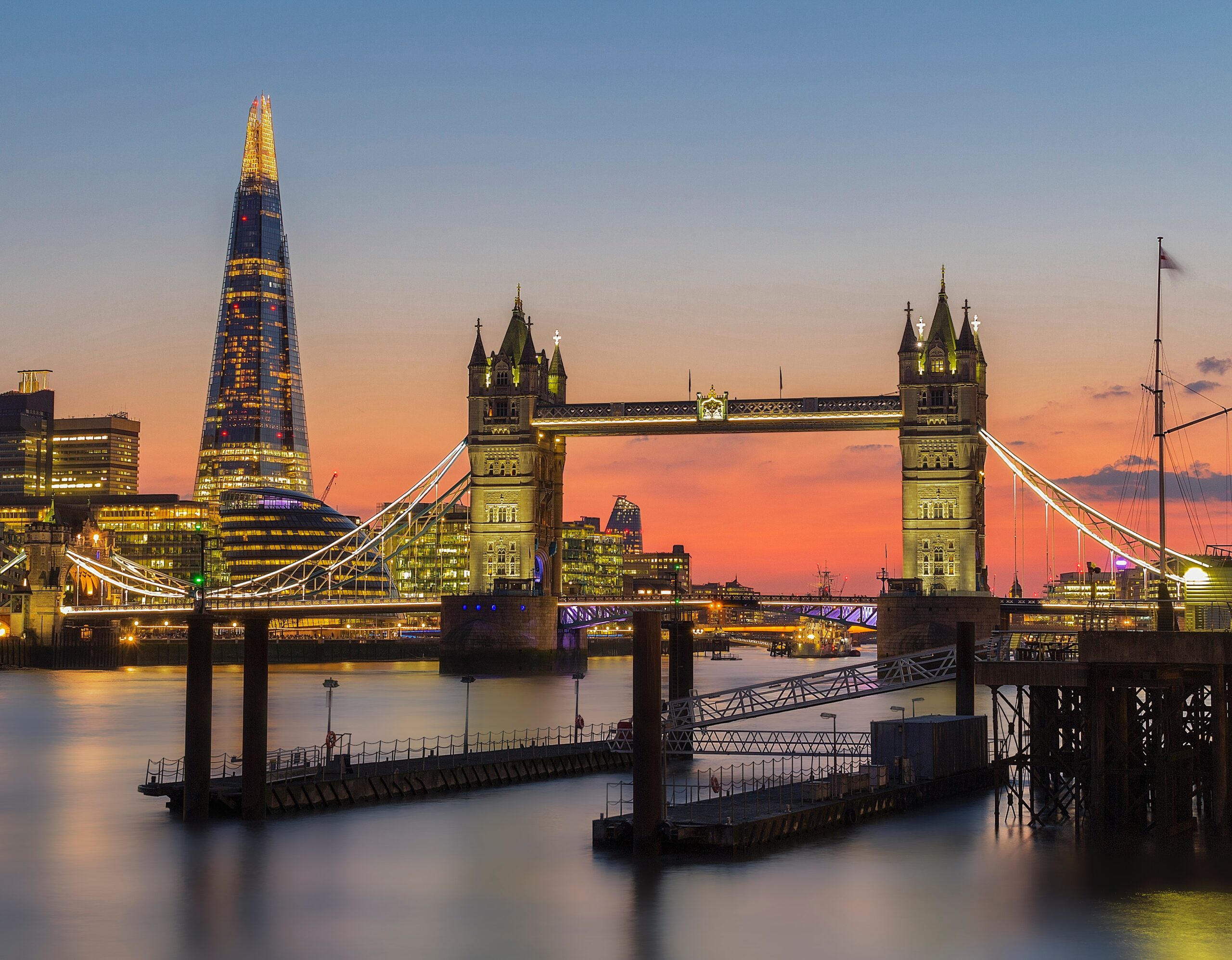 the Shard and Tower Bridge at sunset in London.