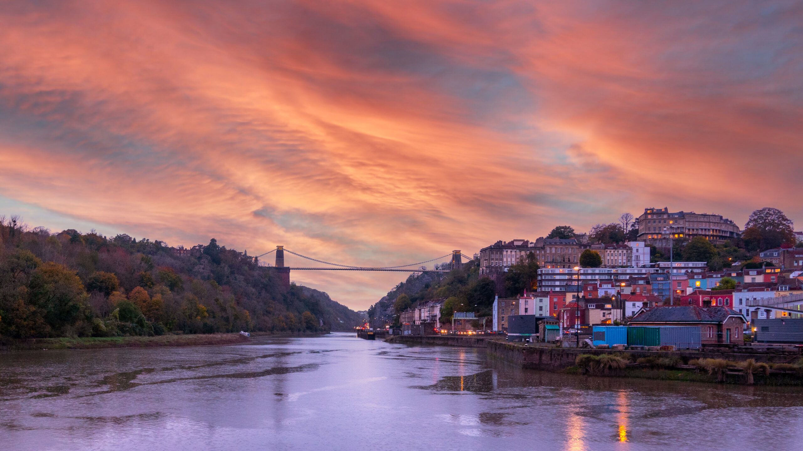 Bristol harbour and Clifton suspension bridge at sunset.