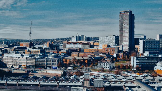 Sheffield skyline with train station in foreground.