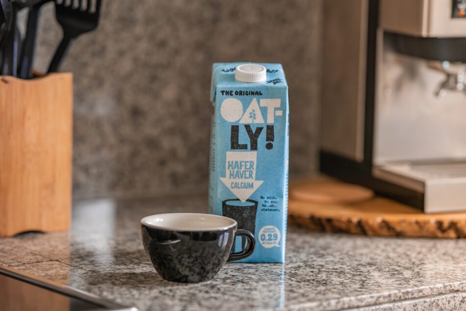 oat milk carton and coffee cup.