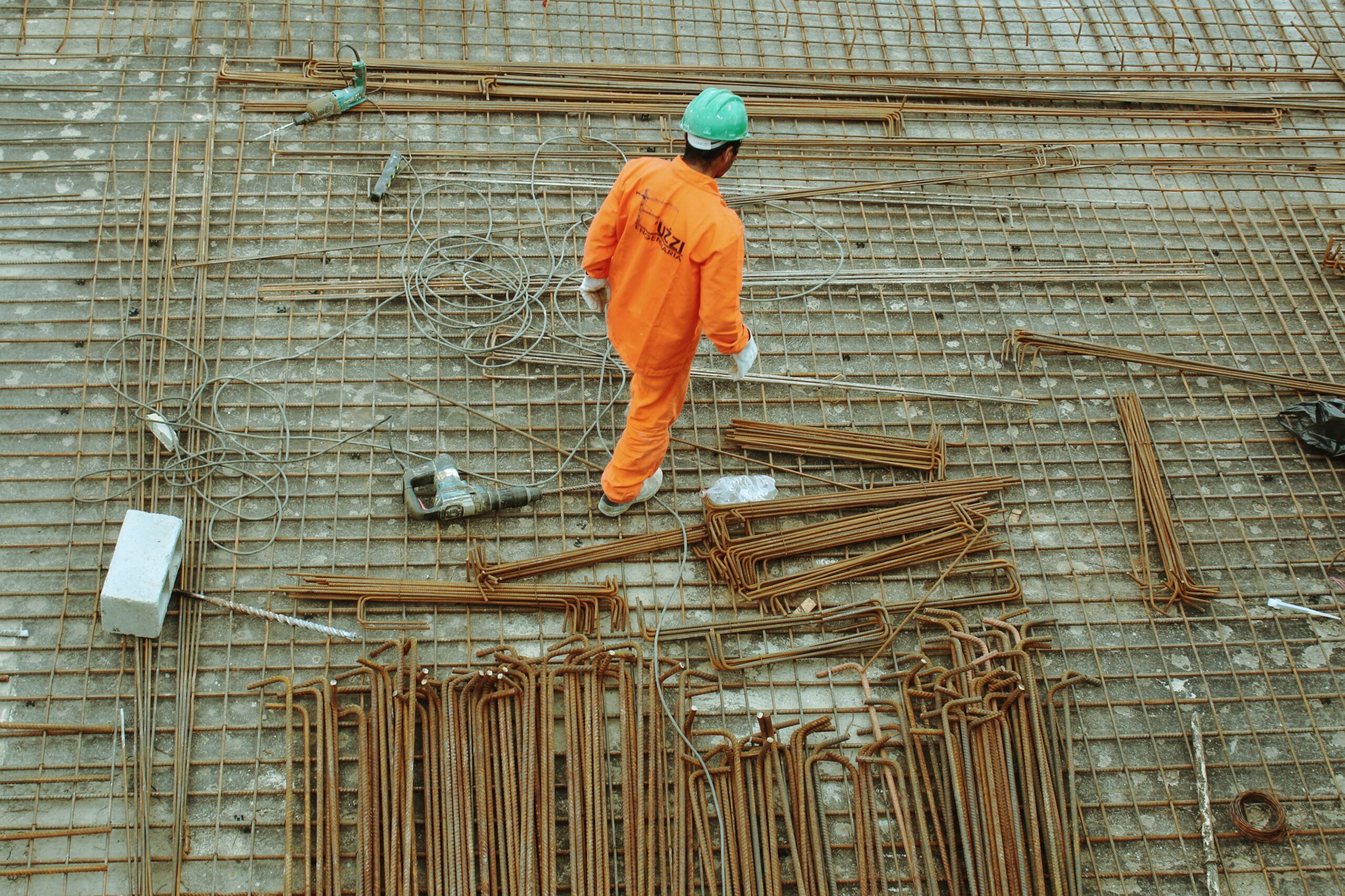 workman in orange jumpsuit.