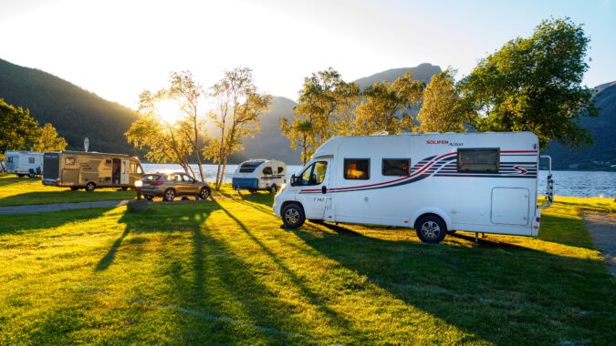 campervans at sunset on campsite.