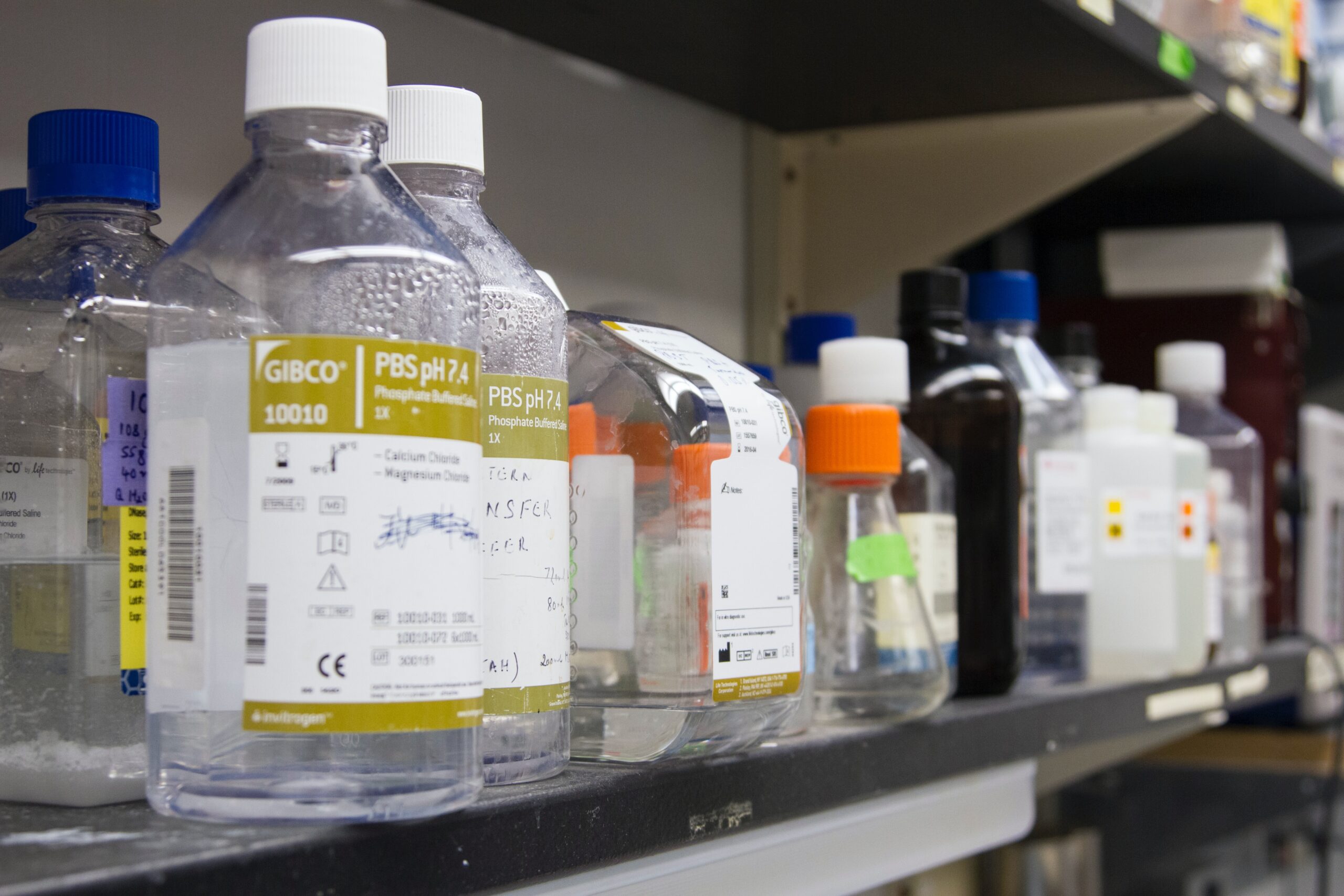 bottles of chemicals on a shelf.