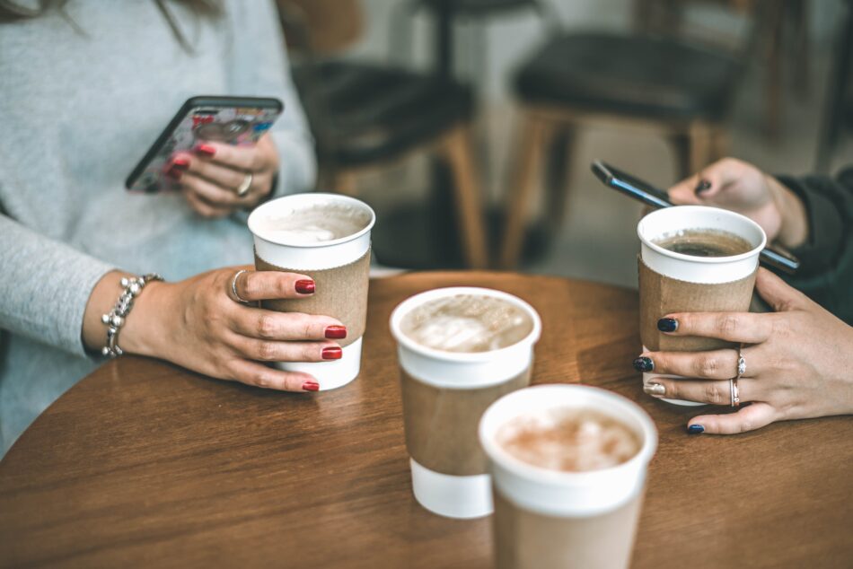 paper coffee cups on a table.