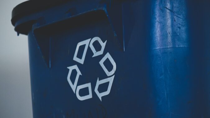 recycling logo on bin.