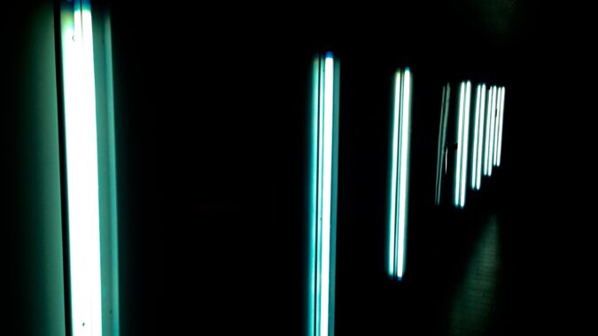 vertical fluorescent lights on wall.