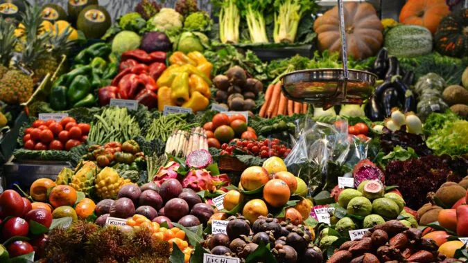 fruit and vegetables for sale at a stall.