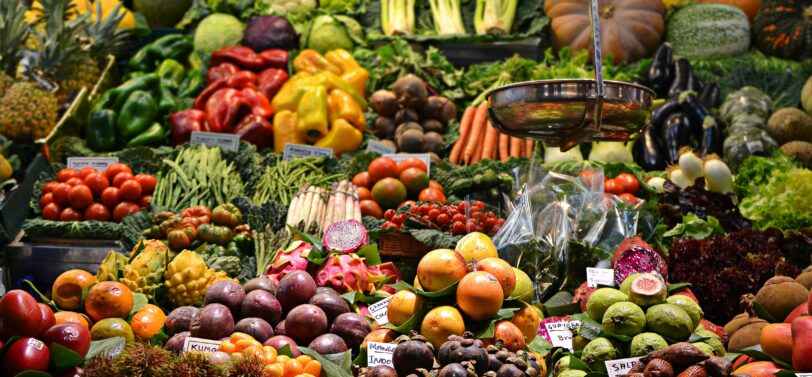 fruit and vegetables for sale at a stall.