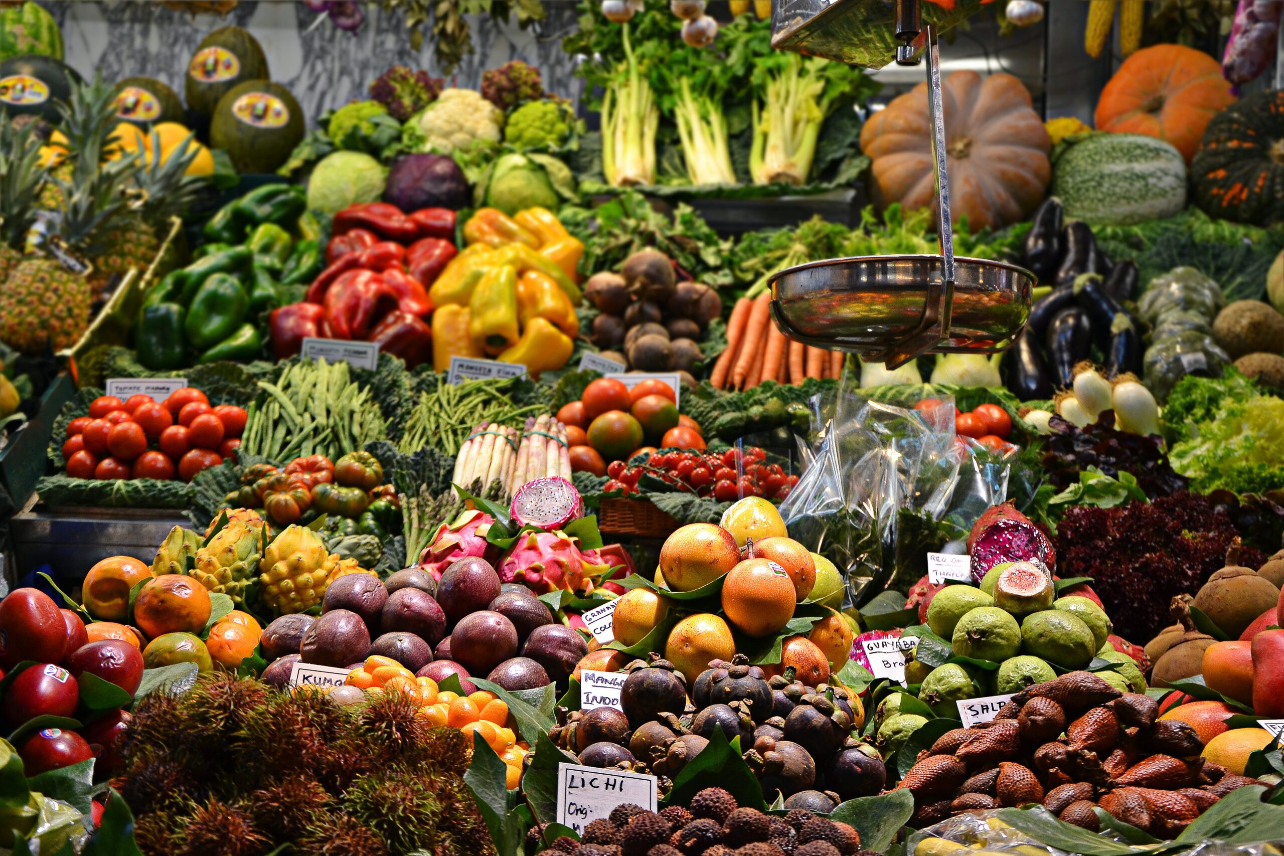 fruit and vegetables for sale at a stall.