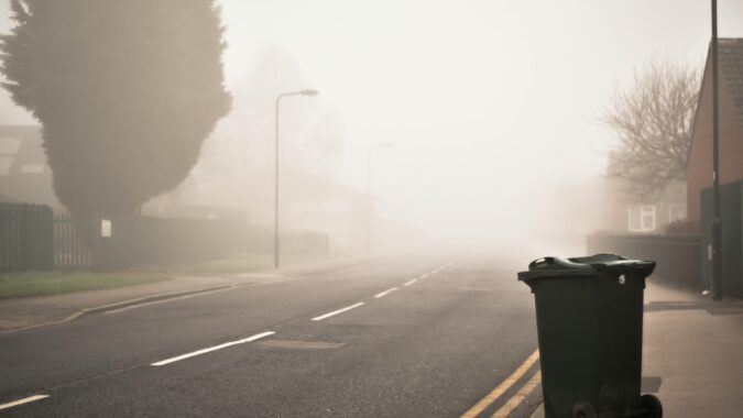 general waste bin on empty street.