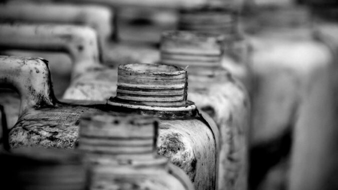 open tops of hazardous waste bottles.