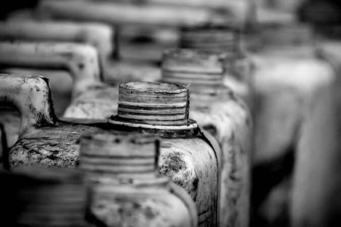 open tops of hazardous waste bottles.