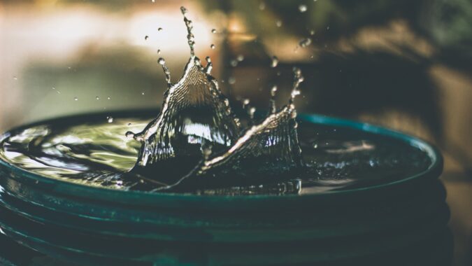 splash of liquid in bucket.