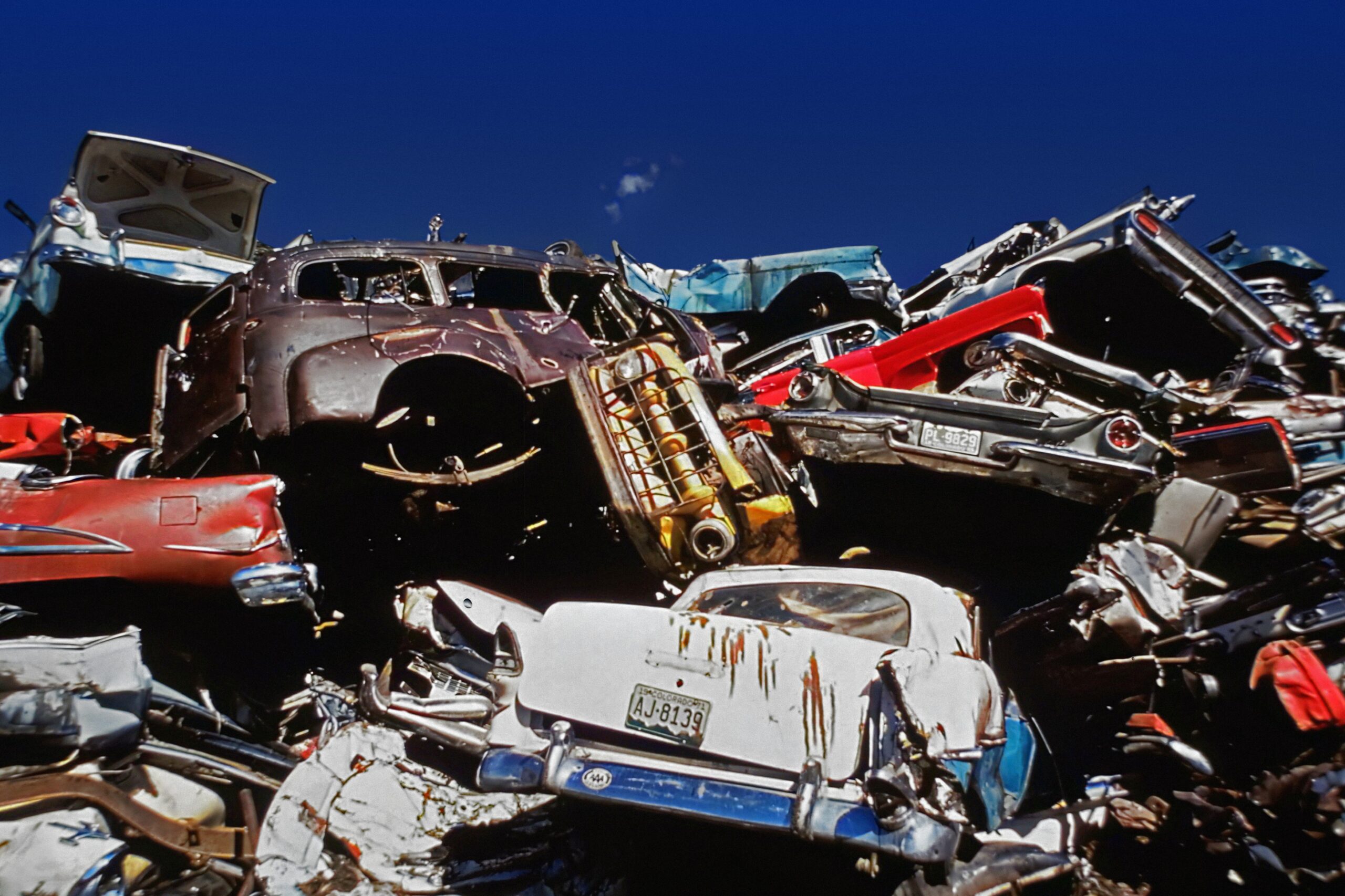 old cars in a scrap metal yard.