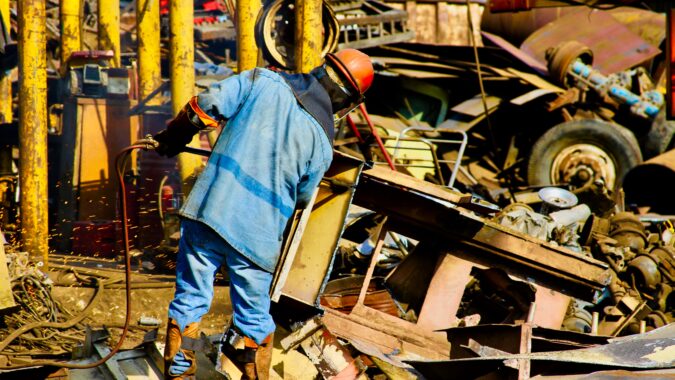 man in scrap metal yard.