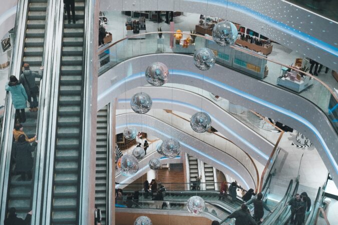 overhead view of escalators in shopping mall.
