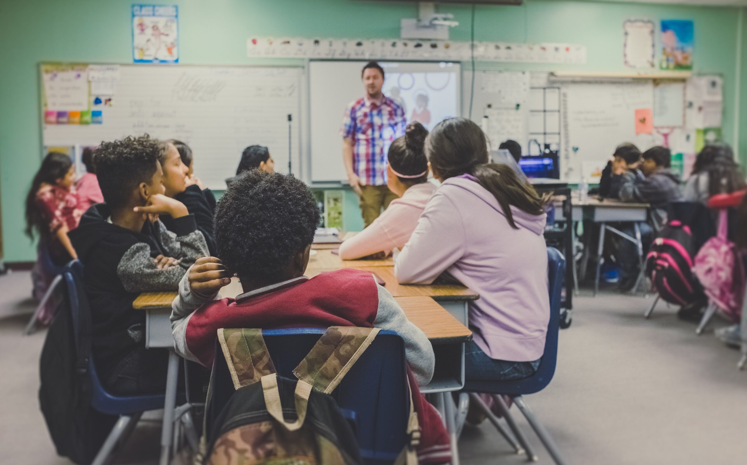 children in a classroom at school.