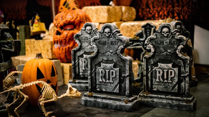 plastic halloween decorations gravestone and pumpkin.
