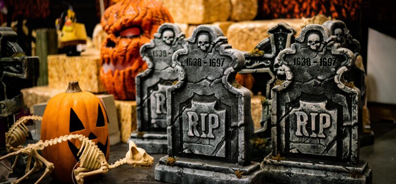 plastic halloween decorations gravestone and pumpkin.