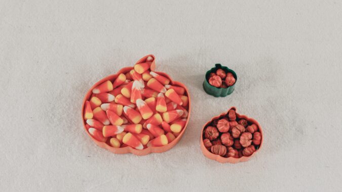 halloween sweets in pumpkin shaped dish.