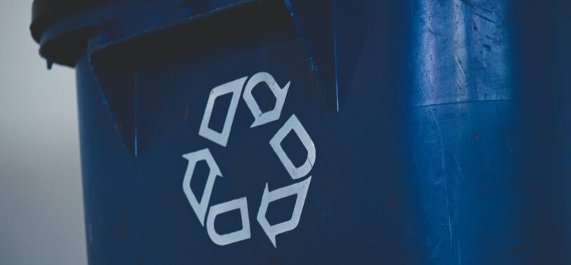 recycling logo on front of bin.