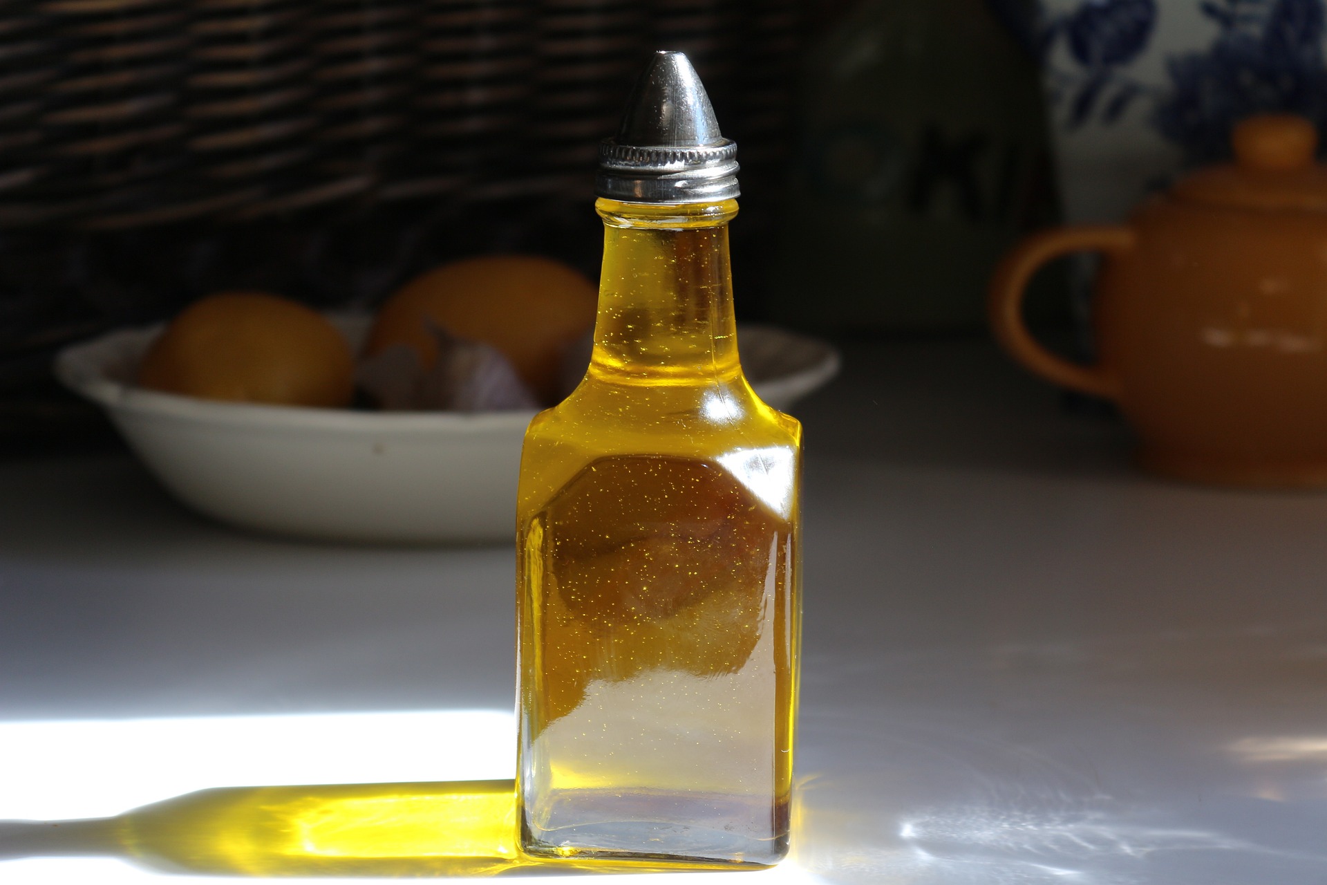 small full bottle of cooking oil on table.