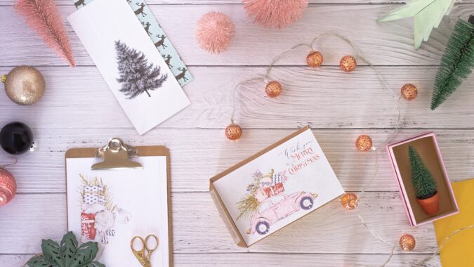 Christmas cards on wooden table.