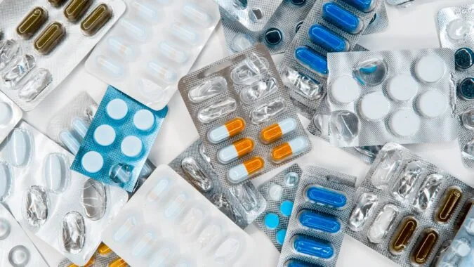 half empty packets of tablets and pills.