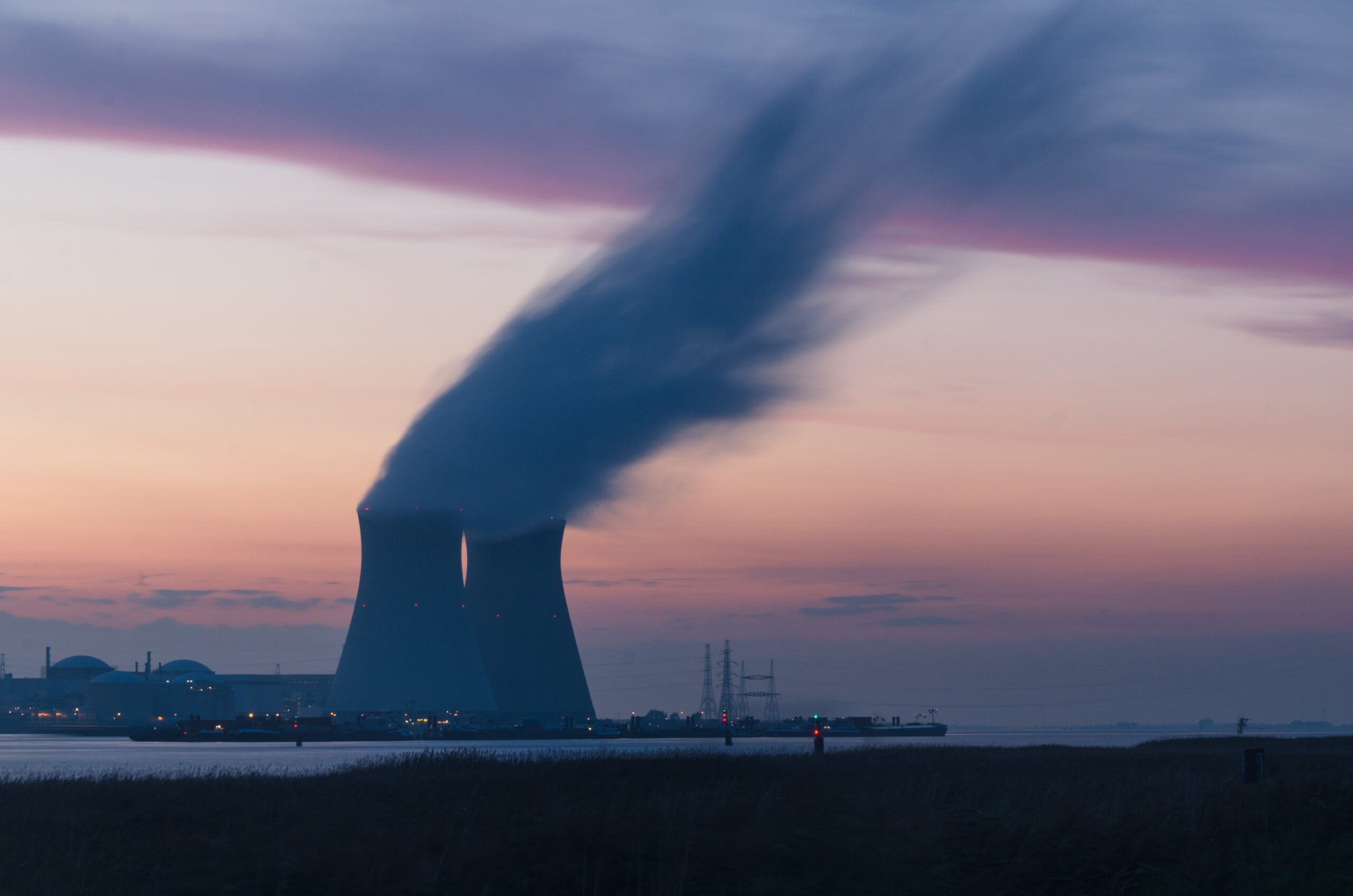 two towers with smoke at nuclear power plant.