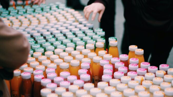 plastic bottle tops on bottles of juice.