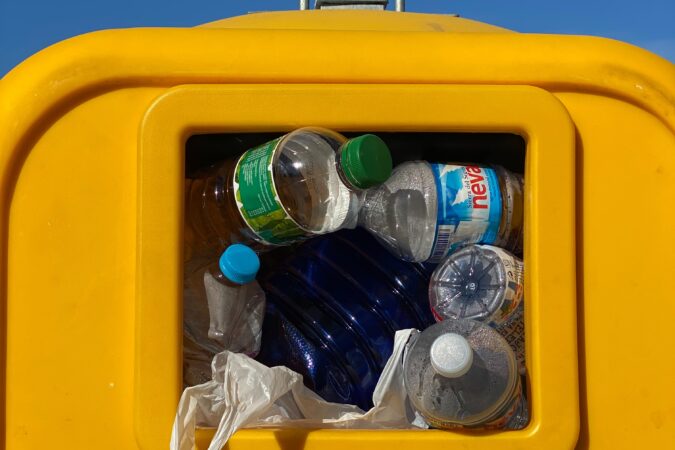 plastic bottles in a recycling bin.