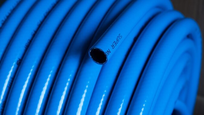 blue PVC pipe coiled up.