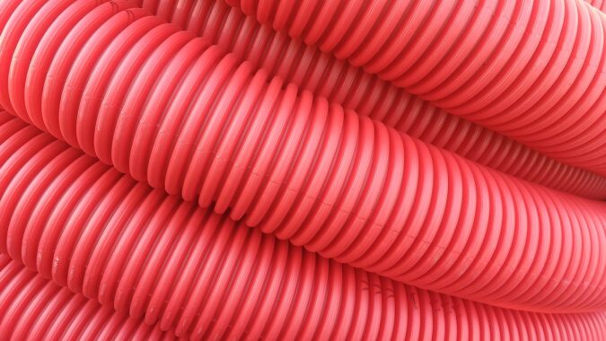 ridged red tube made of HIPS plastic.