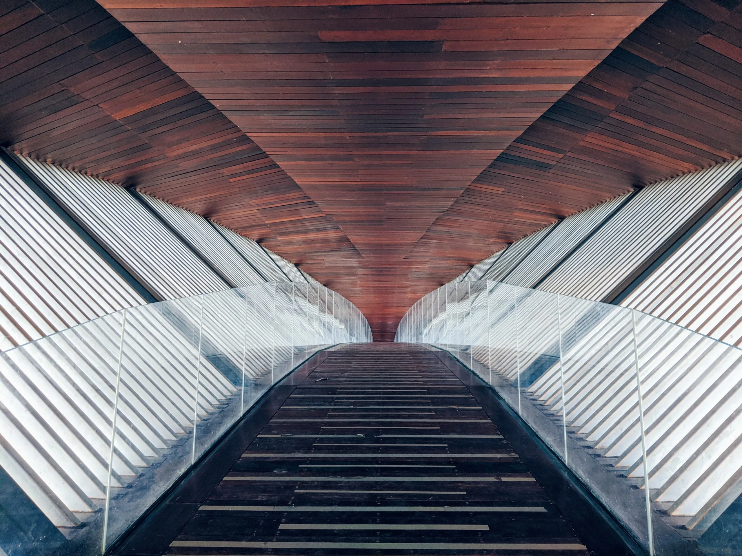 acrylic plastic barriers on the edge of a walkway.