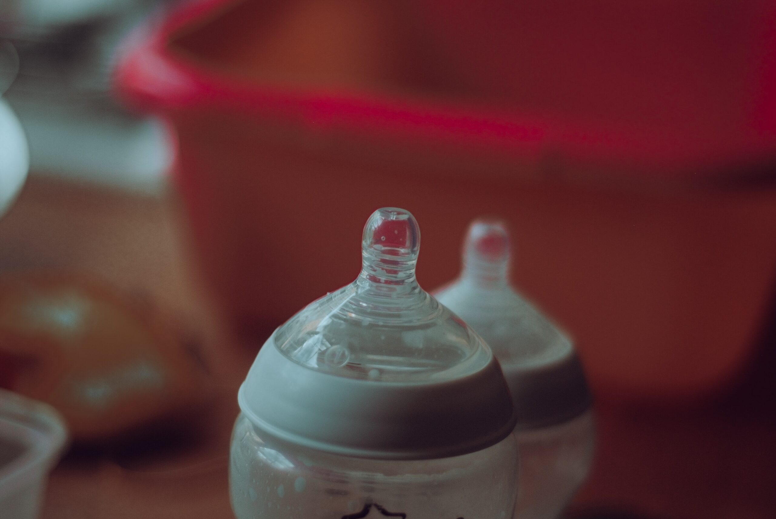 tops of two baby bottles.