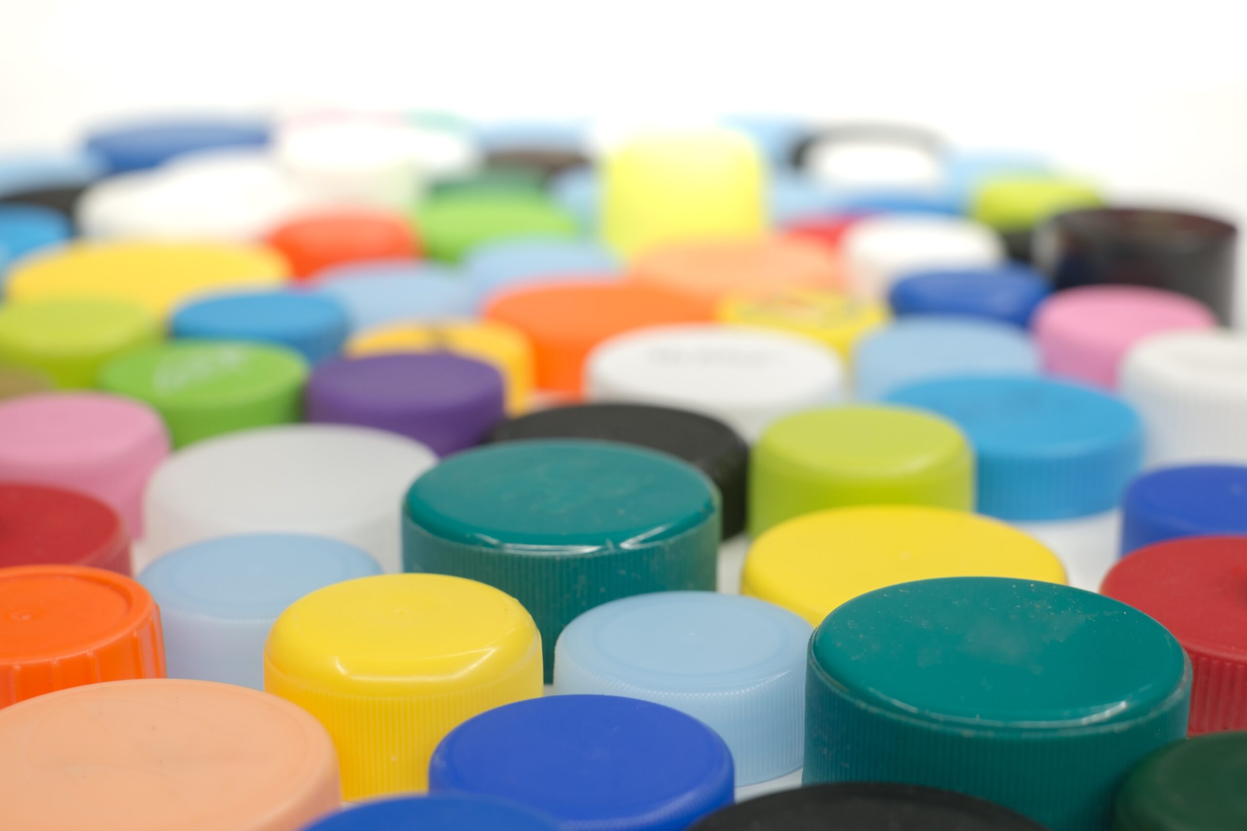 multi coloured bottle tops made from LDPE plastic.