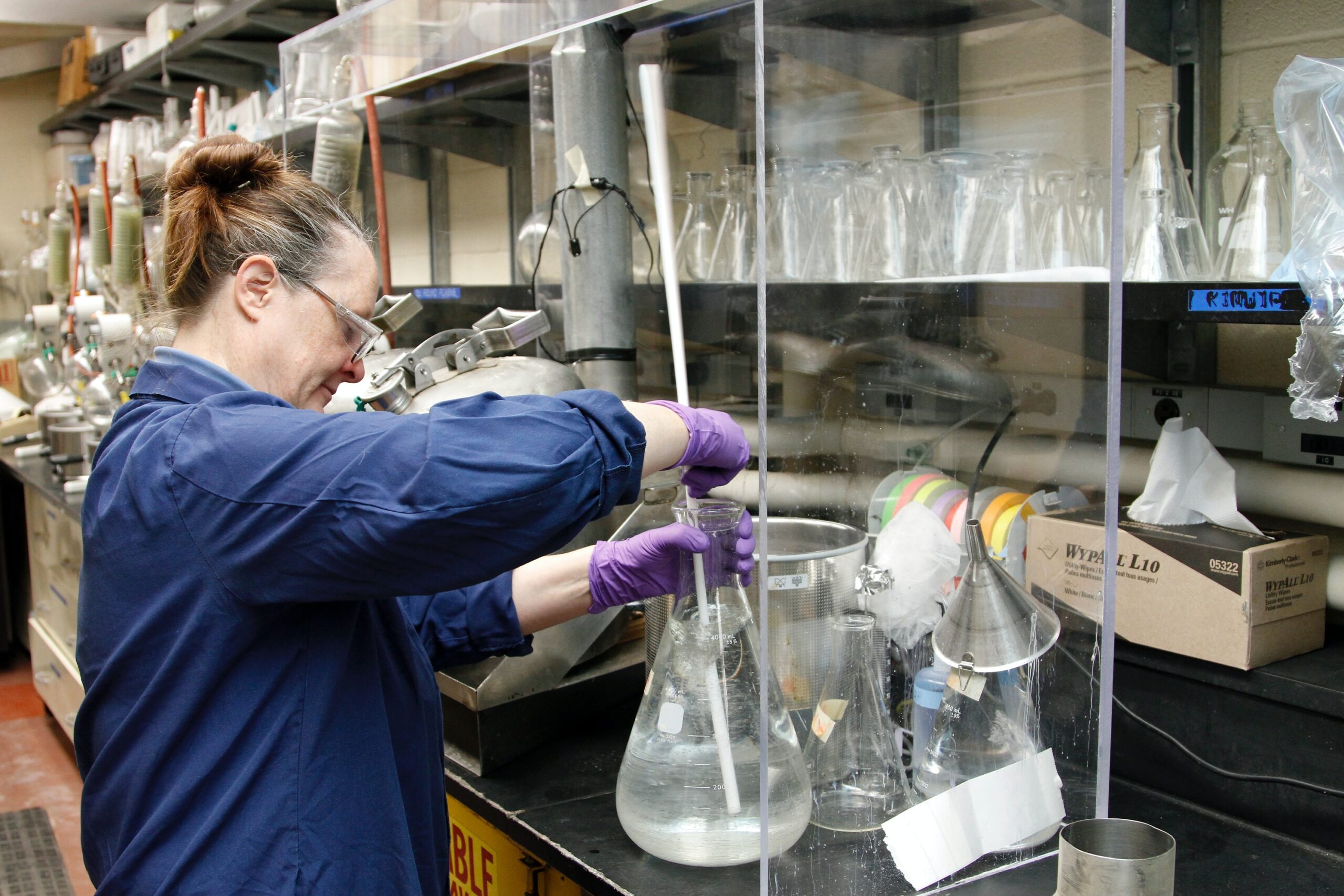 woman in laboratory working with chemicals.