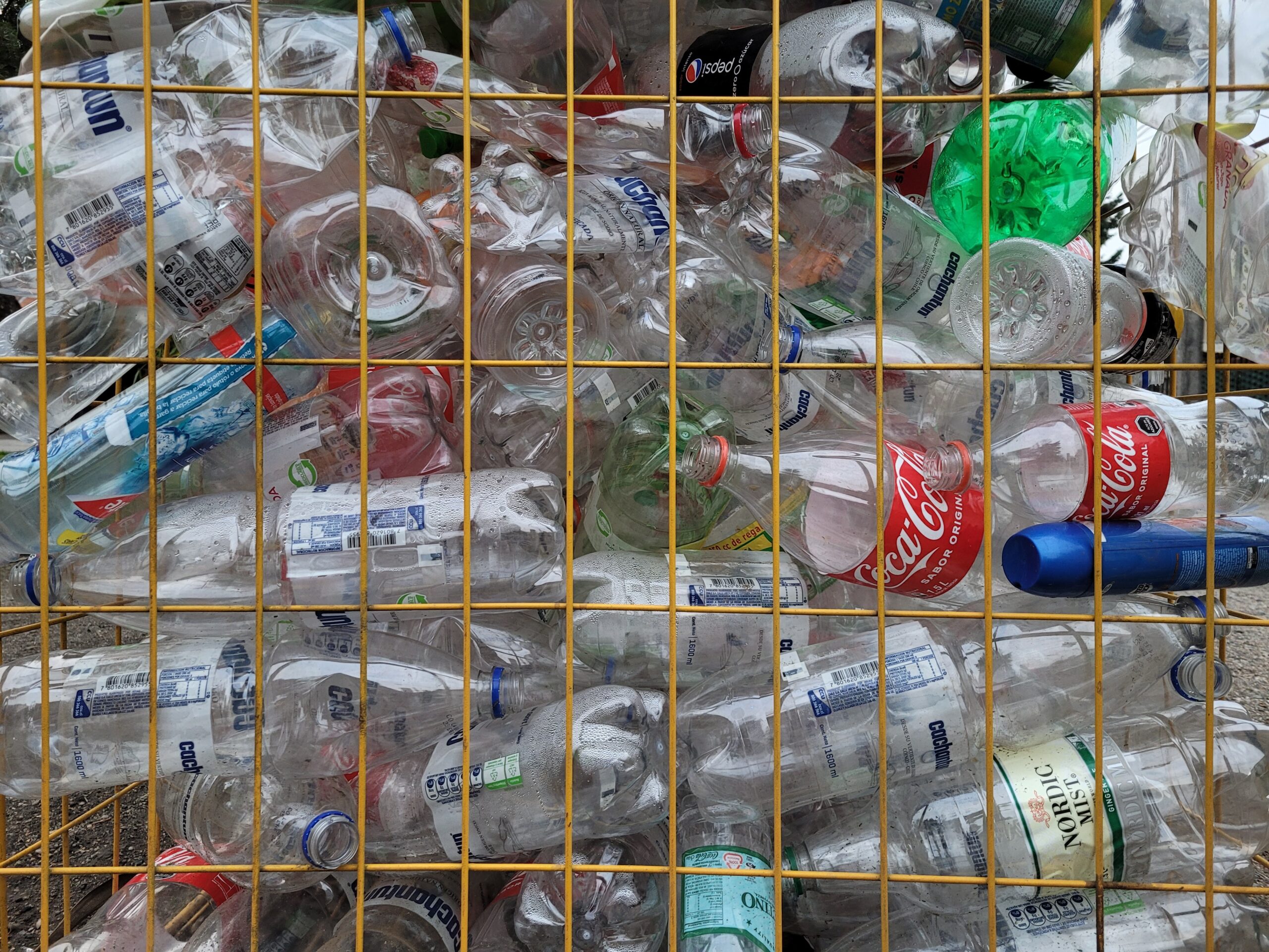 plastic in cage at a materials recovery facility.
