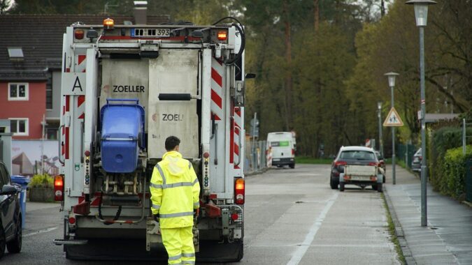 waste truck on street in UK.