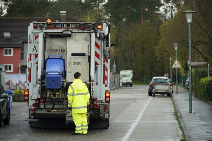 waste truck on street in UK.