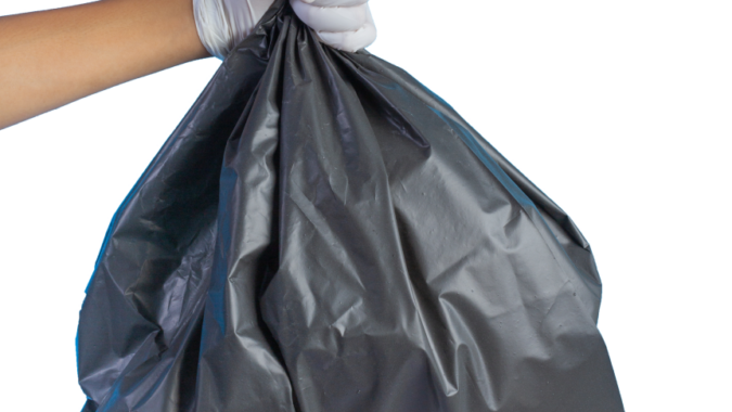 black bin bag with hand