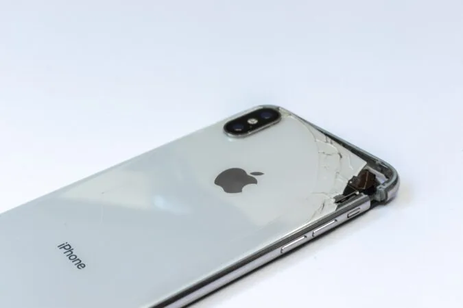 back of an iPhone with a cracked case.