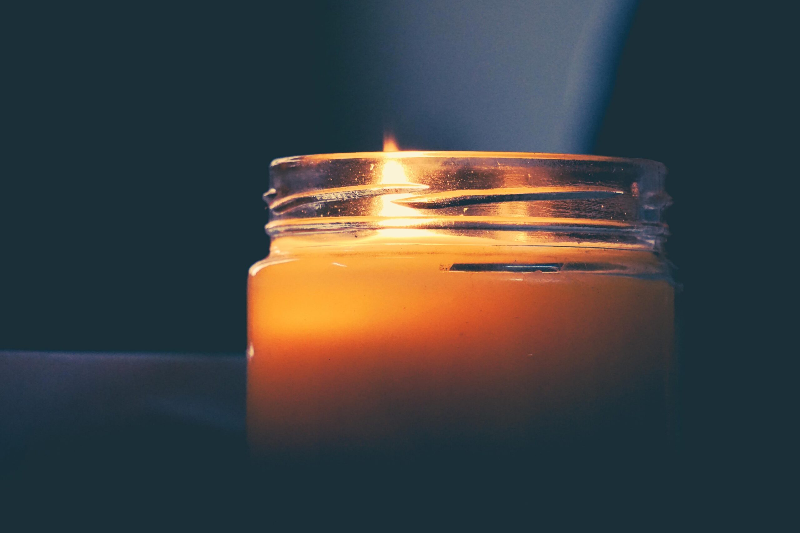 candle in a glass jar.