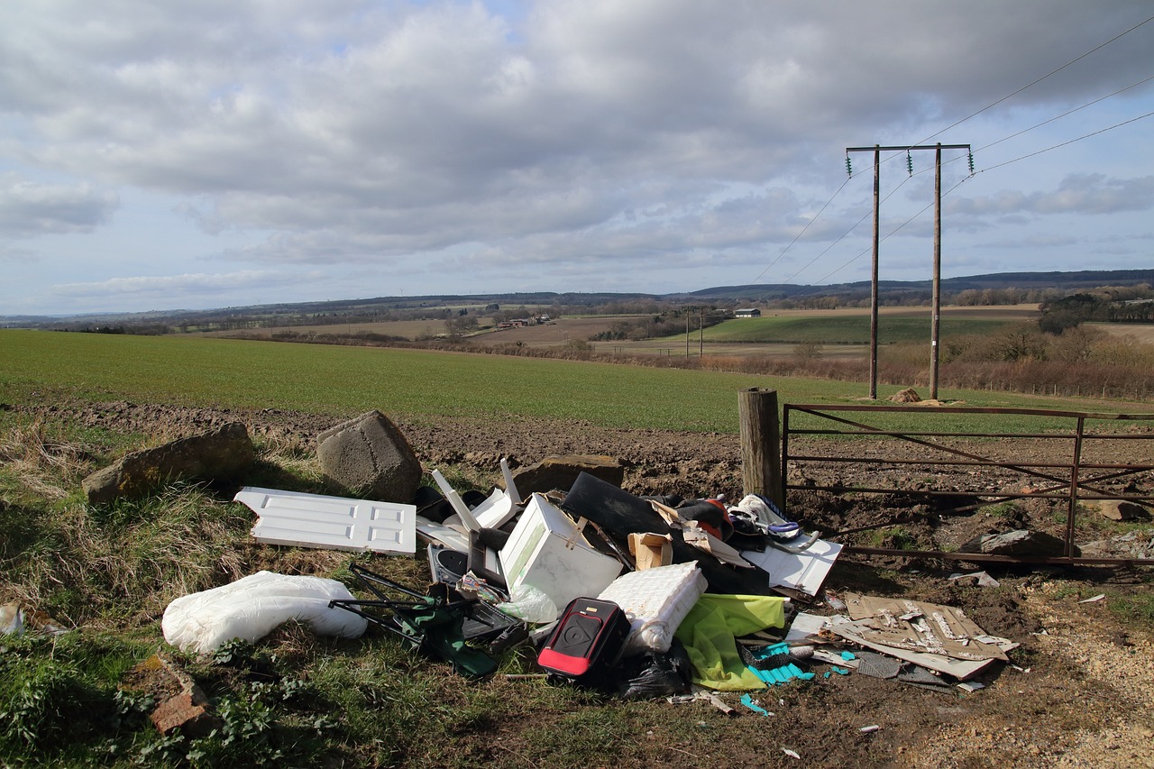 fly tipping next to a field in England.