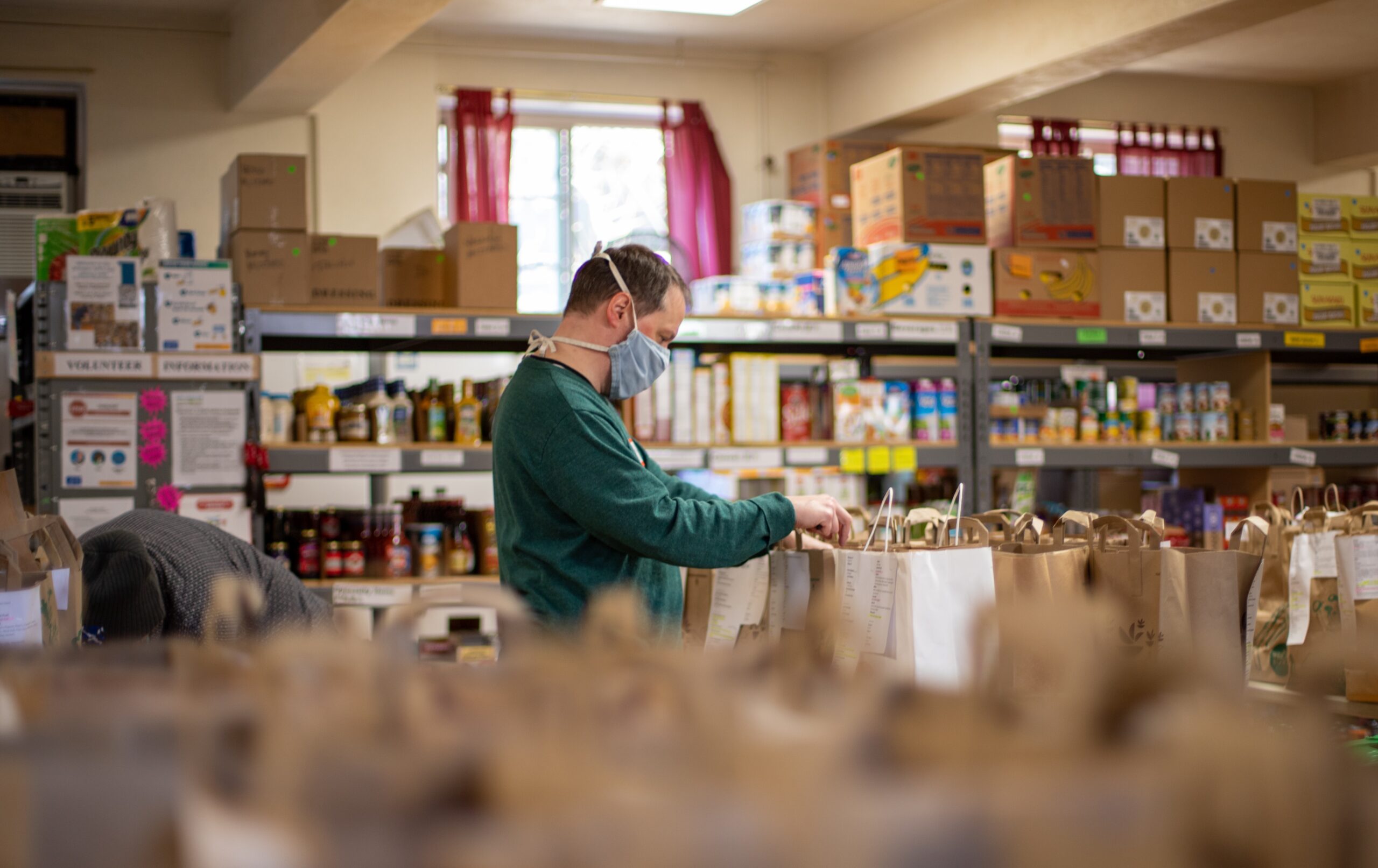 man working in food bank.