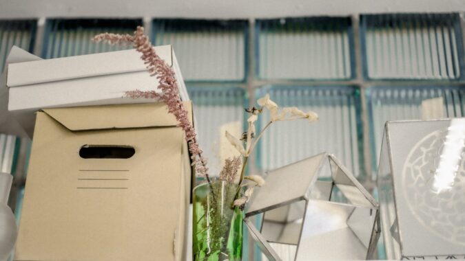 cardboard box on a shelf as storage.