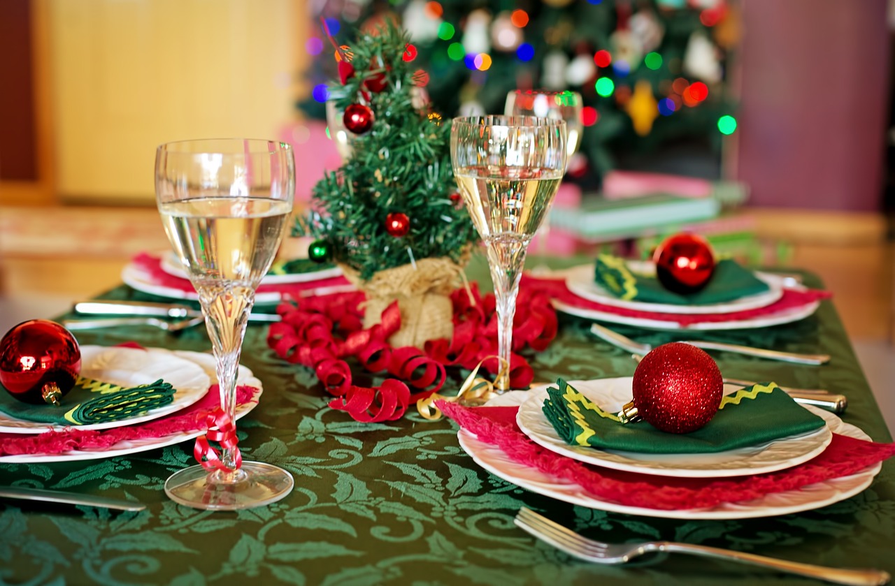 Christmas dinner table set up with champagne glasses.