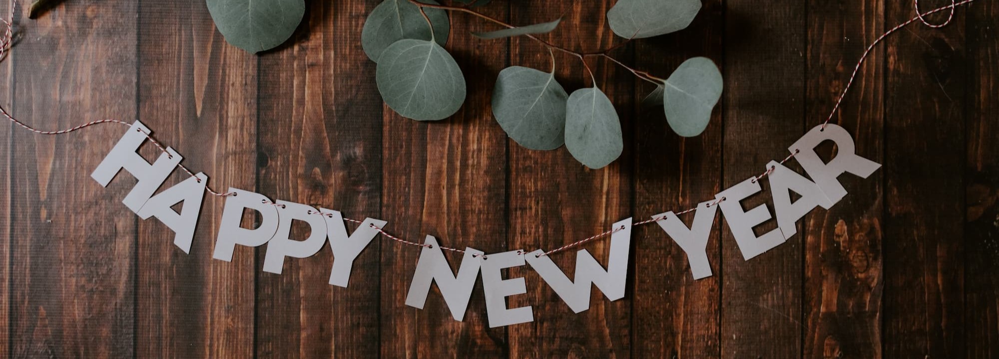 happy new year sign with leaves.