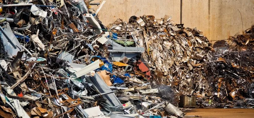 piles of scrap metal in a yard.